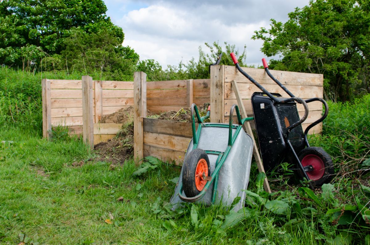 3 medium sized wooden compost bins.