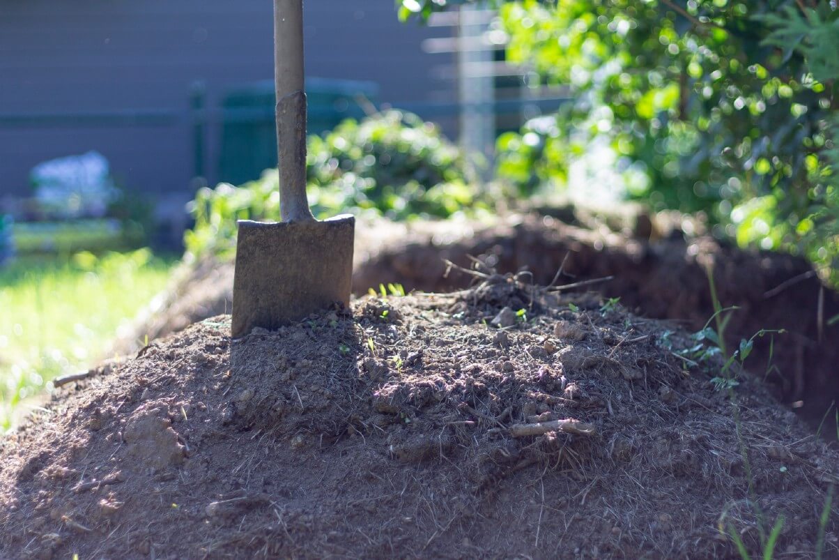 pile of compost with pitch fork