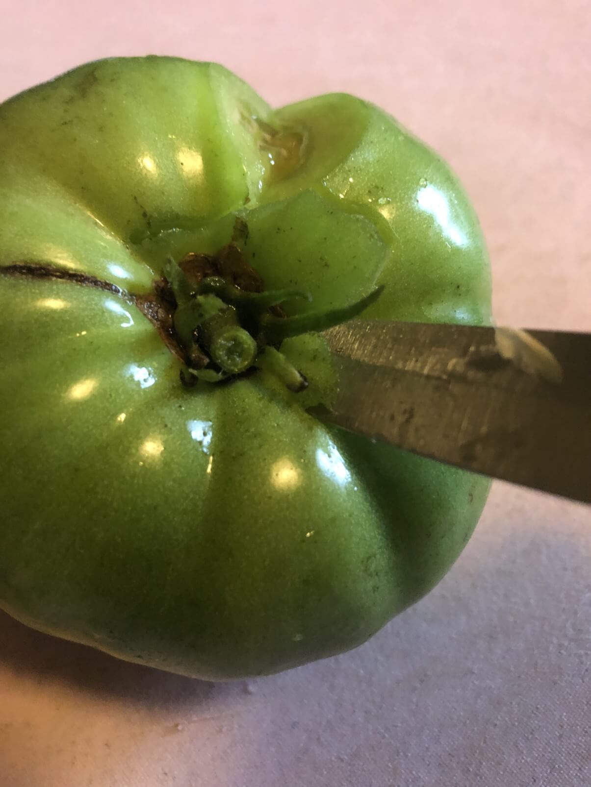 coring a green tomato
