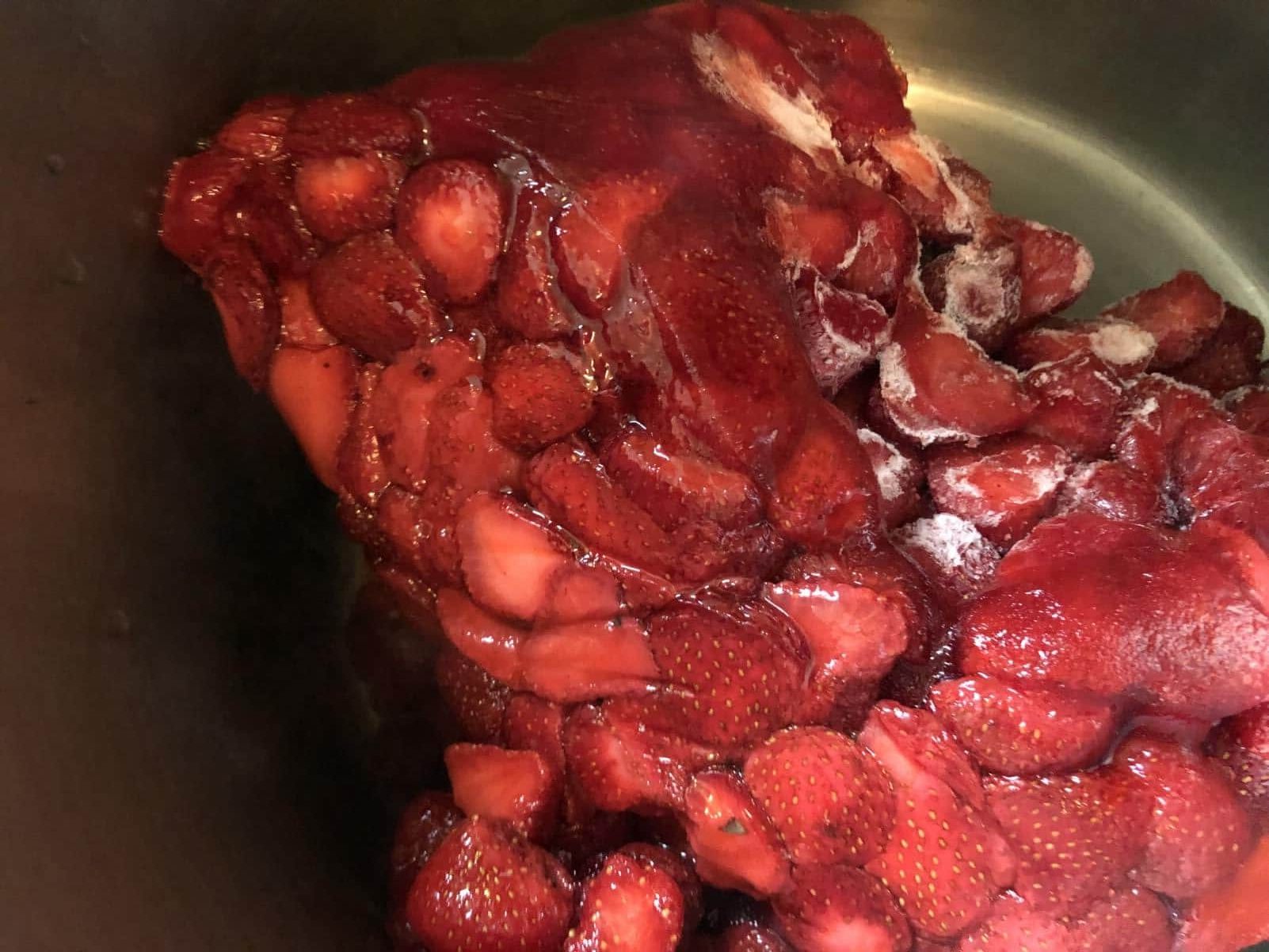 strawberries in pan making jam