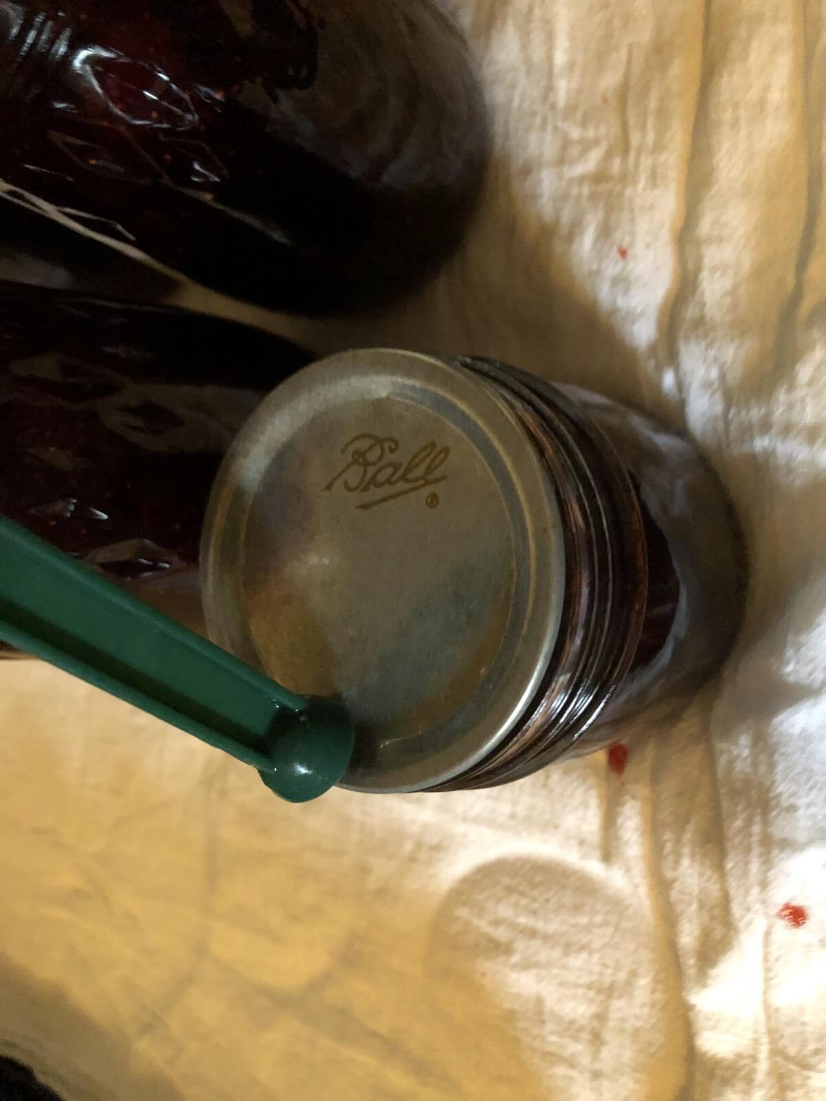 canning wand placing jar lid