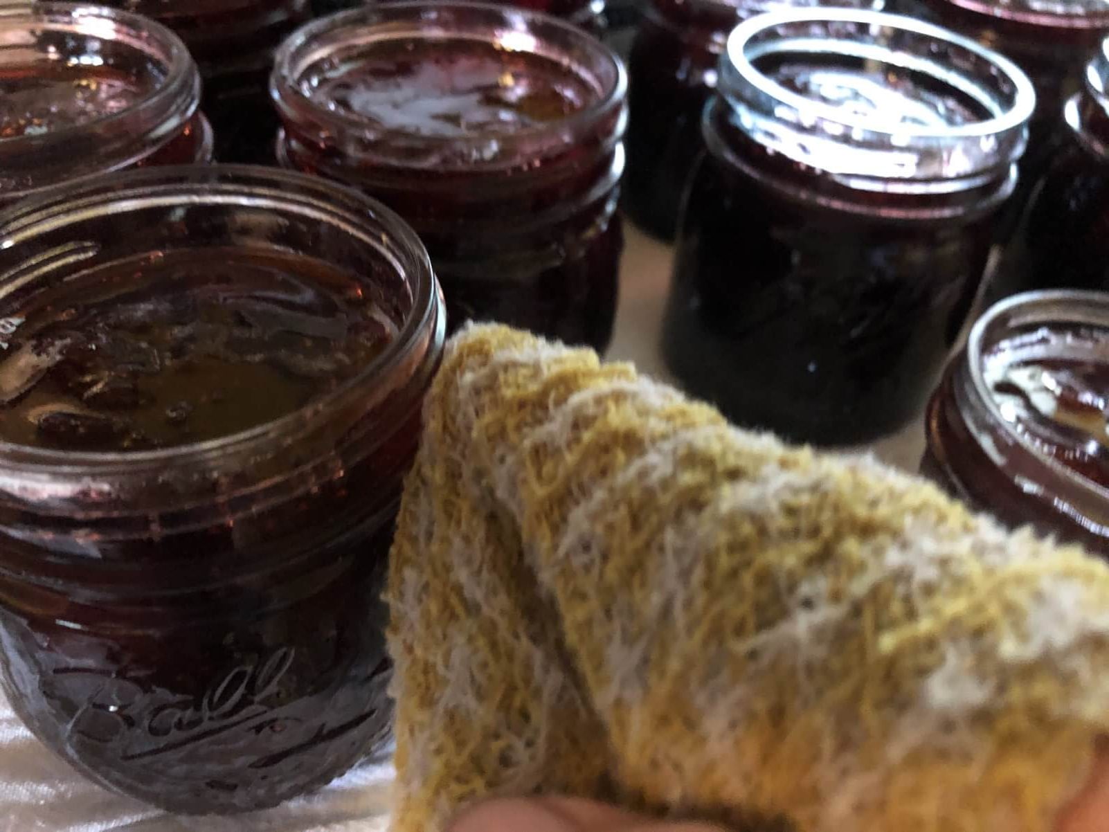 wipeing threads of jam jar before sealing