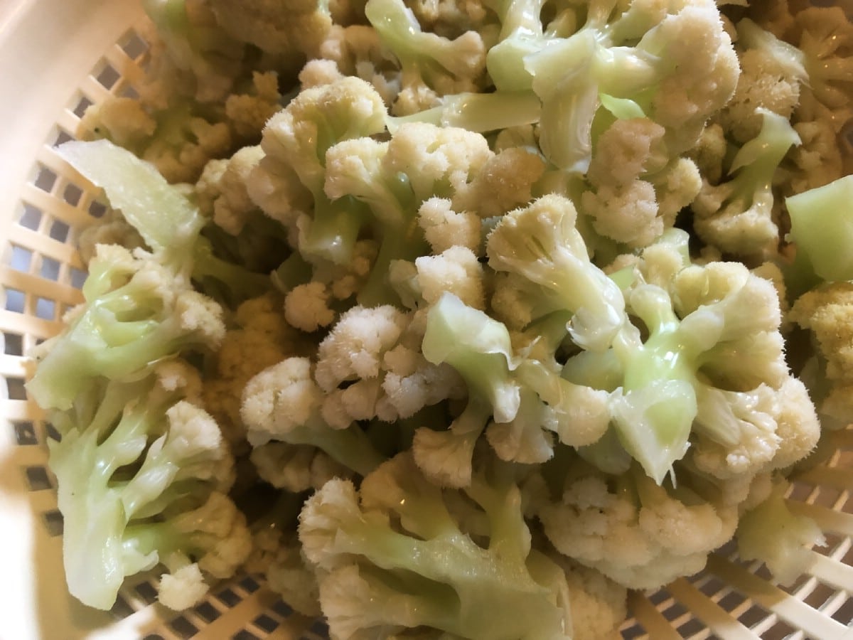 cooked and drained cauliflower in a colander