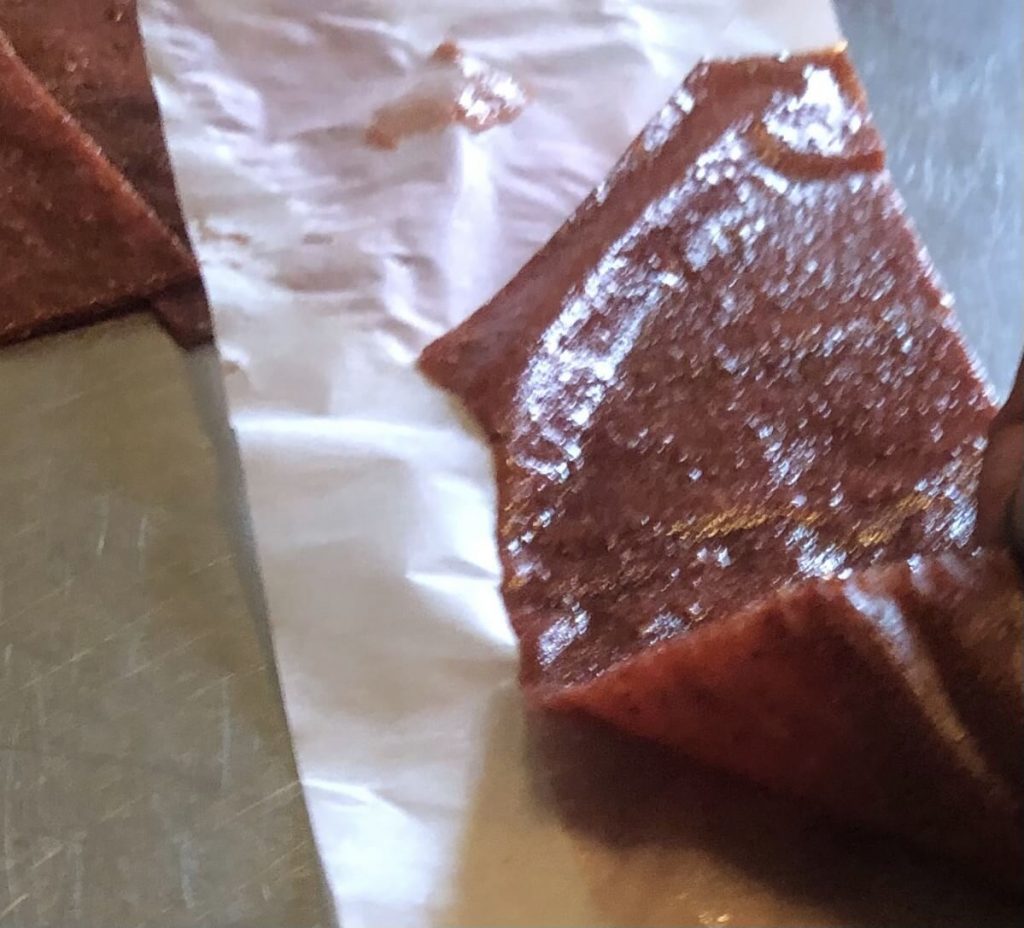 peeling fruit leather up from parchment paper