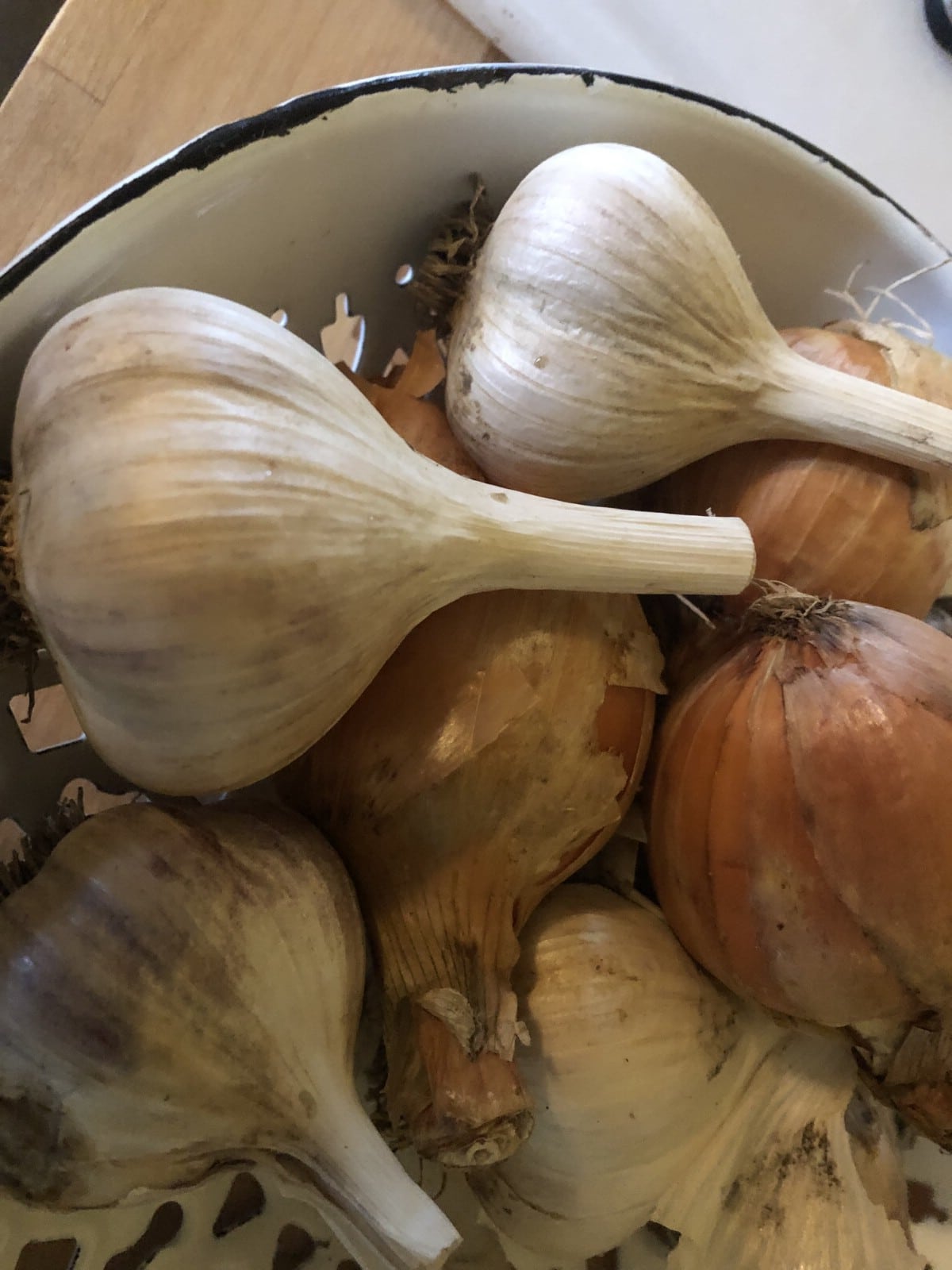 onions and garlic in a basket