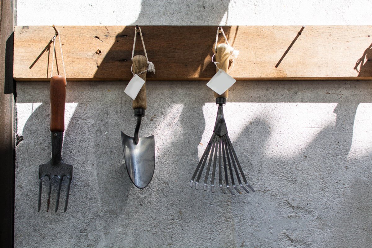 garden hand tools hanging inside