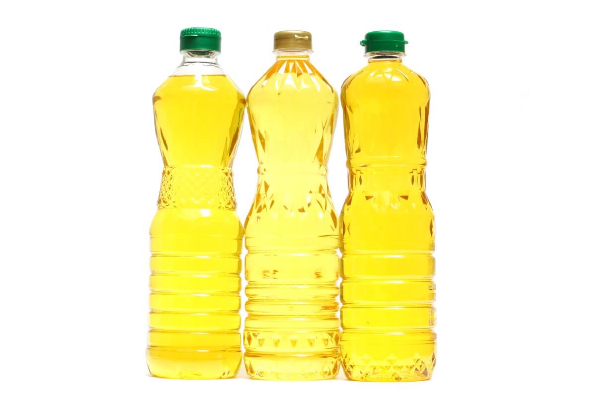three bottles of vegetable oil for oiling garden tools