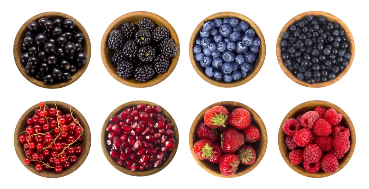 eight bowls of berries with one type in each