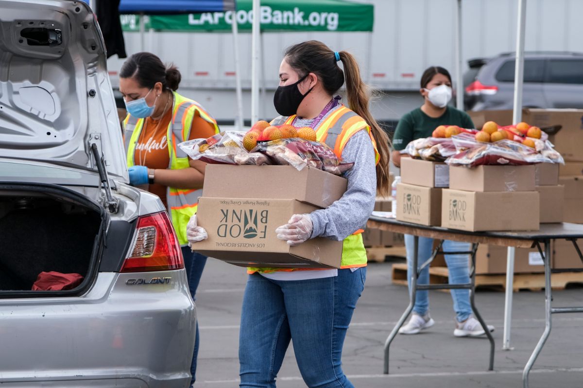 Volunteers loading boxes of food for the needy