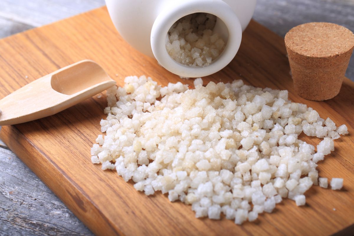 Large grains of Epsom salts dumped out on a cutting board