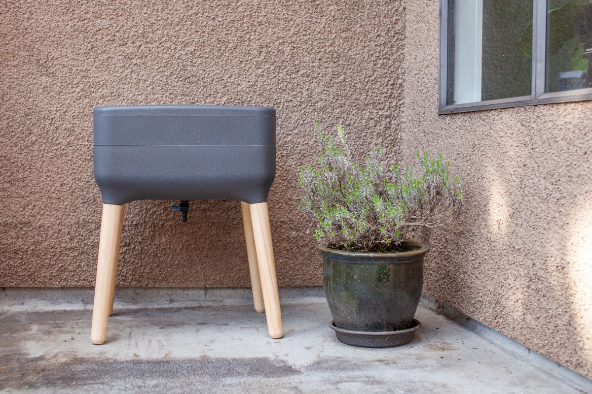 Prefabricated outdoor worm bin on a patio