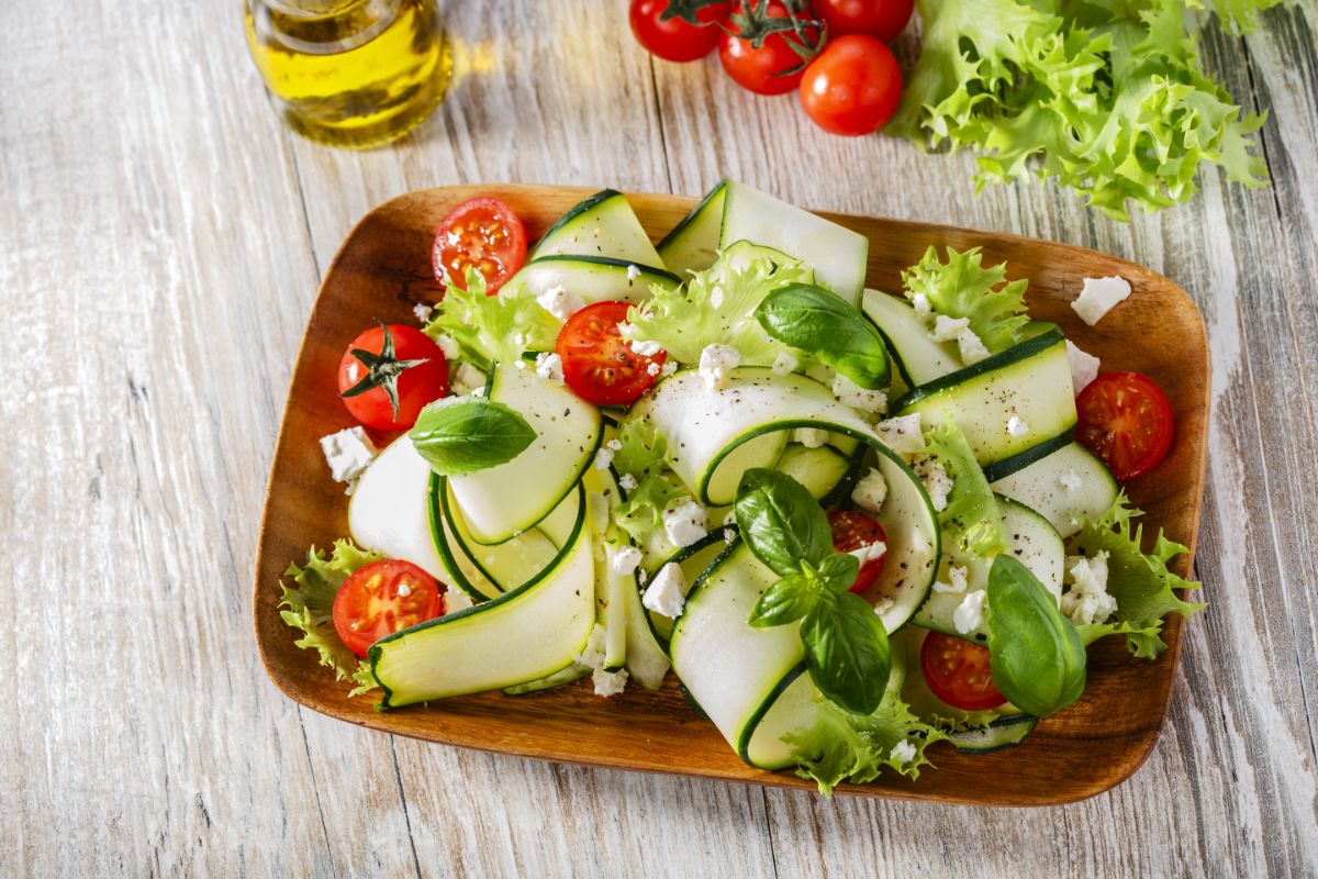 A fresh garden salad with ribbons of fresh zucchini
