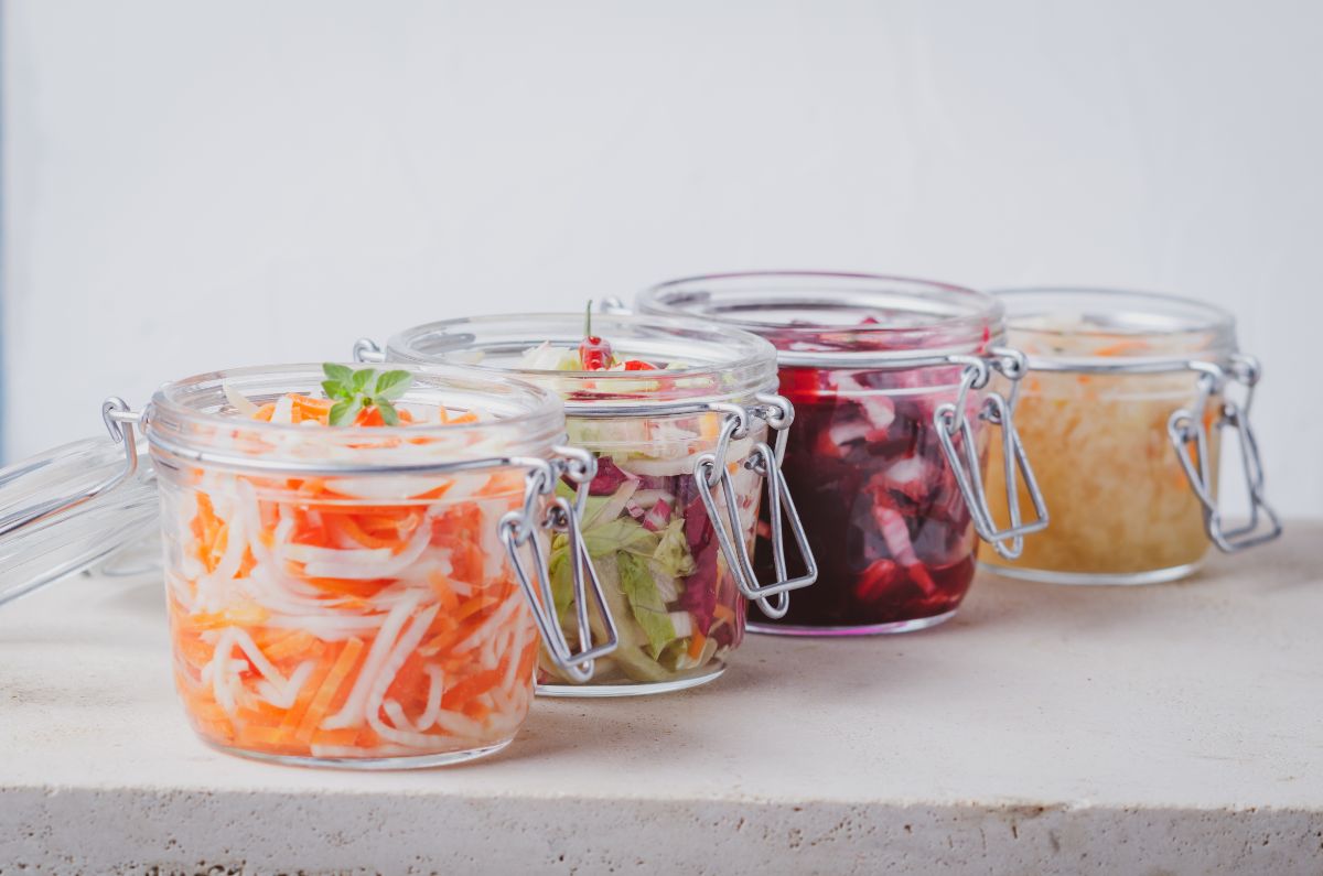 Crocks of lacto fermented vegetables nicely presented on a table