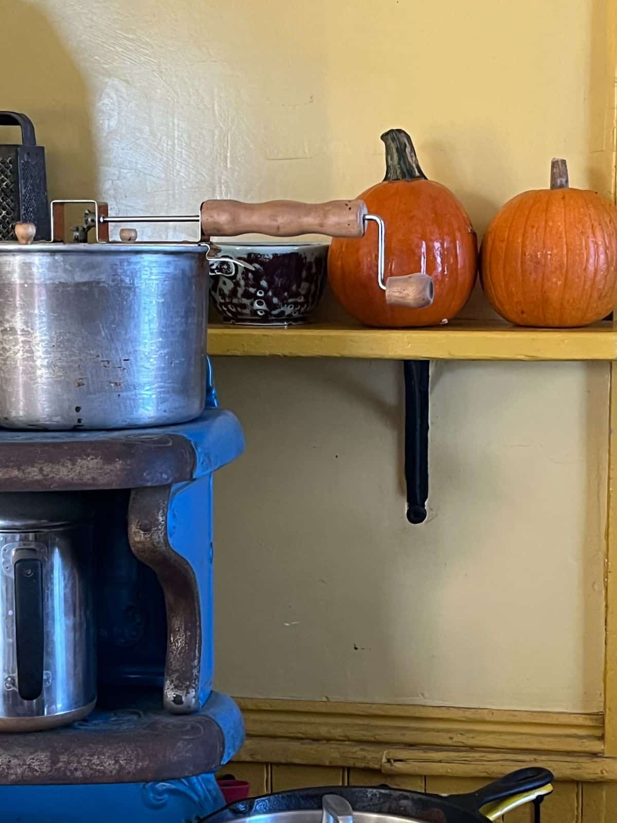 Winter squash on a mantel curing before storage