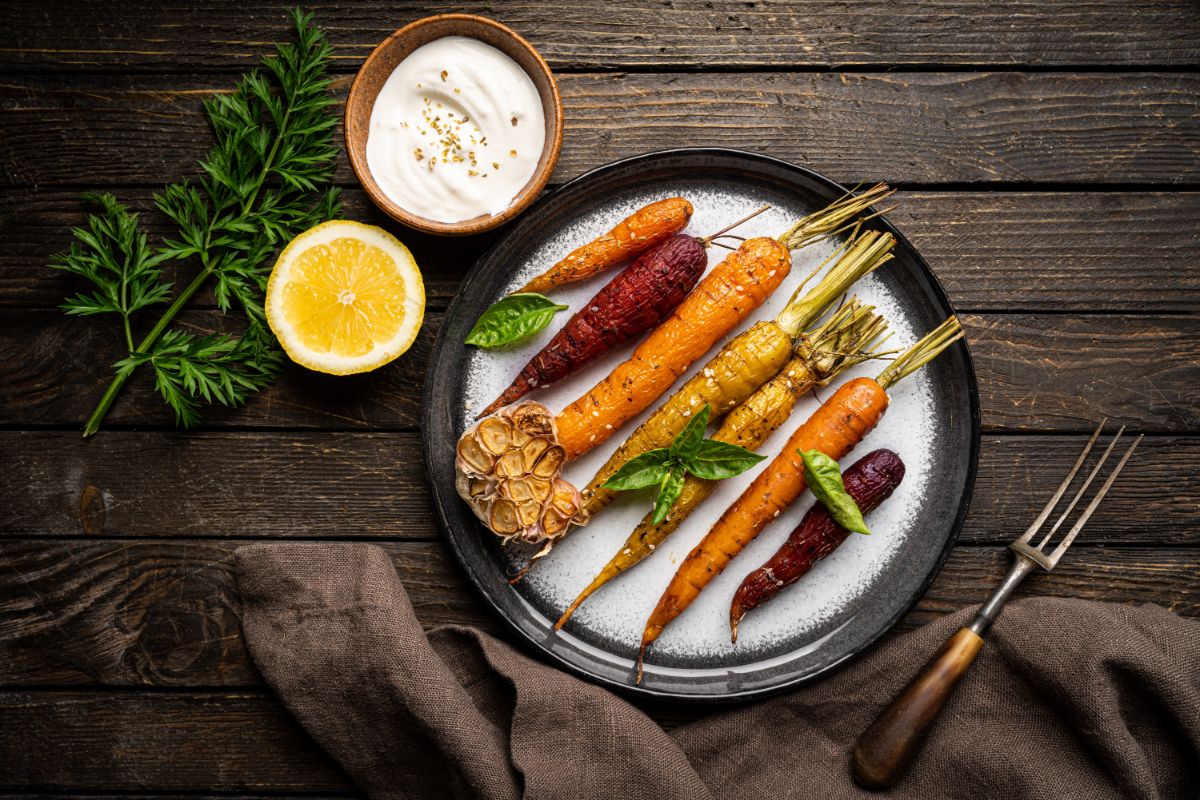 Roasted carrots and roasted garlic on a plate