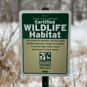 A sign showing the land is a certified wildlife habitat according to the National Wildlife Federation.