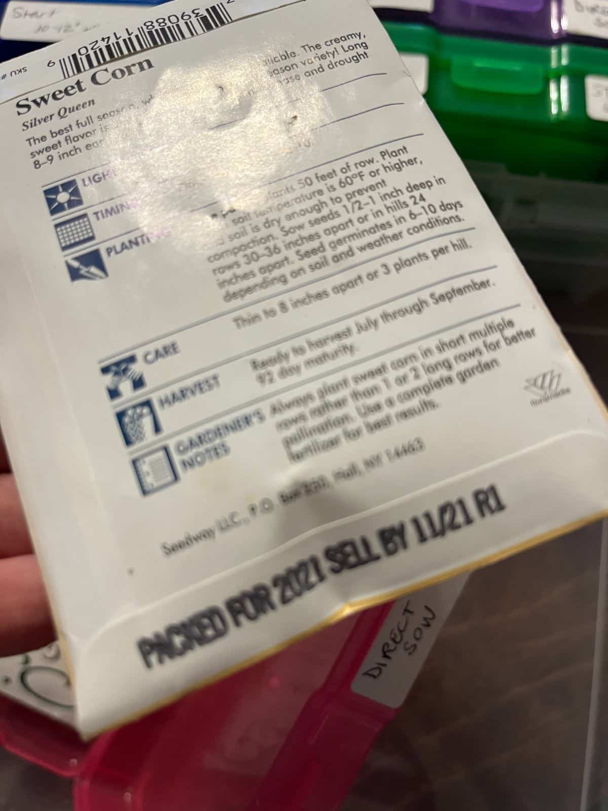 A combined "Packed for" and "Sell By" date on a seed package.