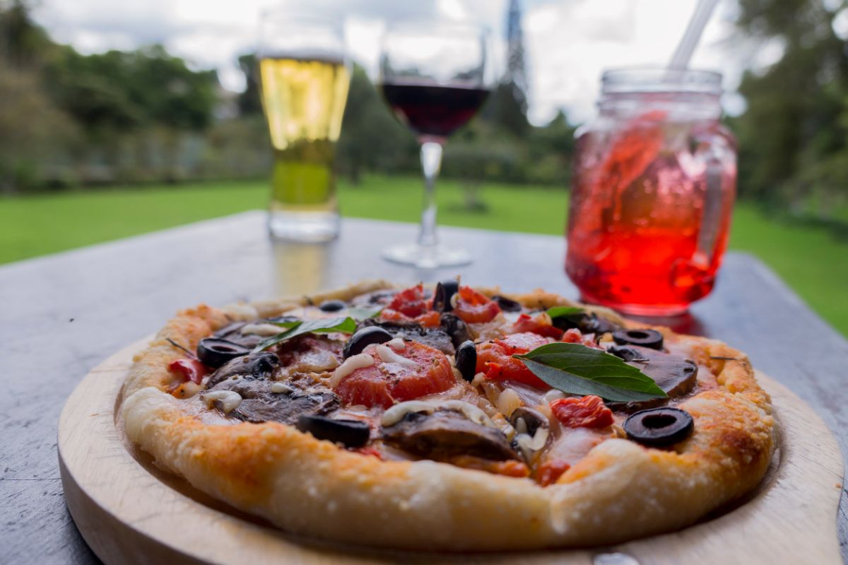 Pizza sauce and toppings grown in a themed square foot pizza garden