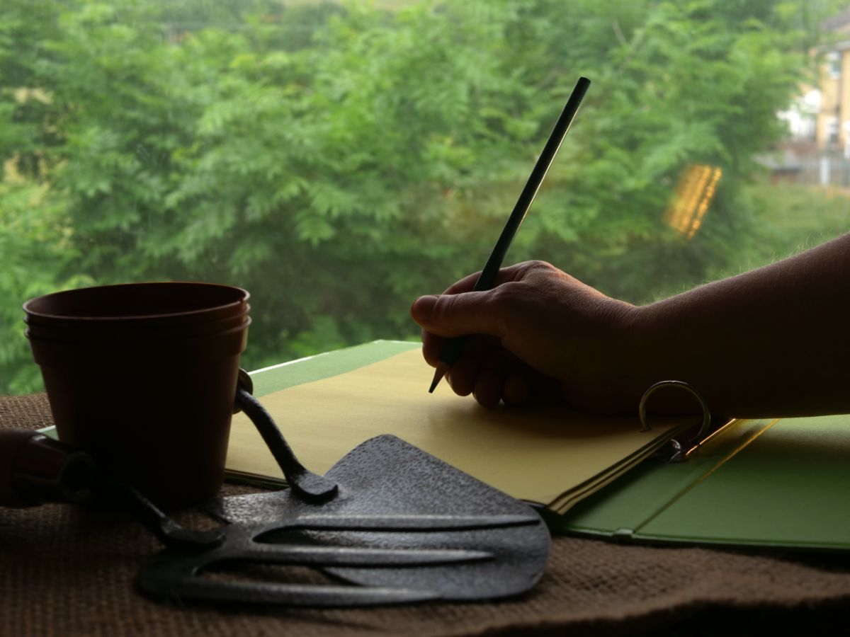 A gardener keeps a journal with rotation planting plans