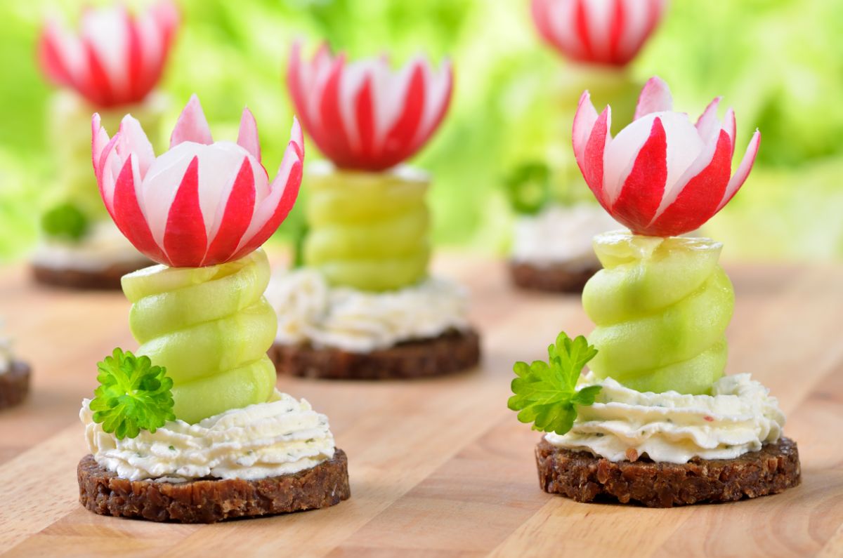 Radishes crafted into decorative flowers on appetizers