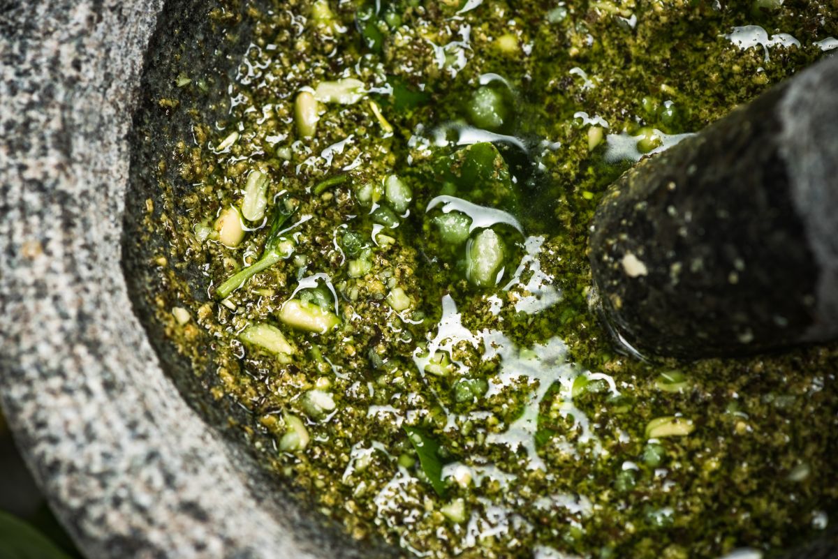 oily pesto in a mortar and pestle