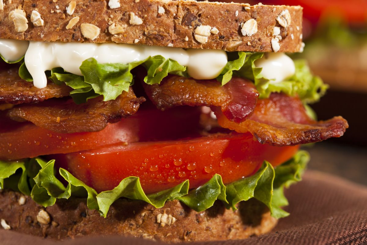 A fresh, red slice of tomato on a sandwich