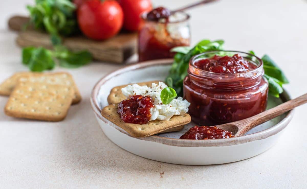 Savory tomato jam with cheese and crackers