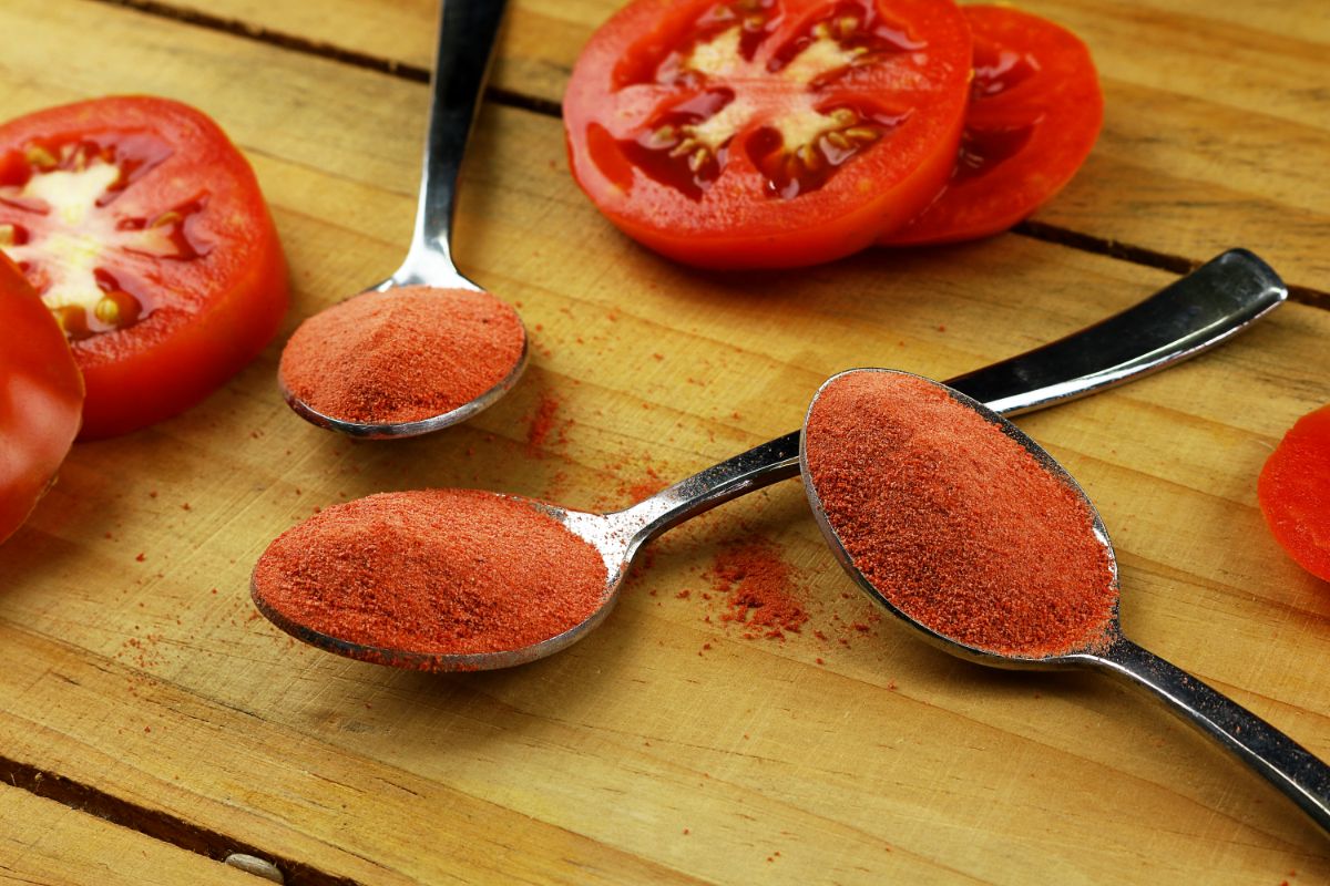 Homemade tomato powder on a spoon