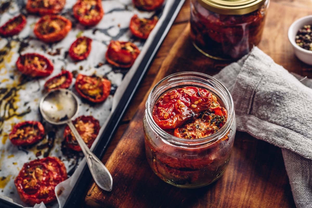 Sundried tomatoes being packed in oil