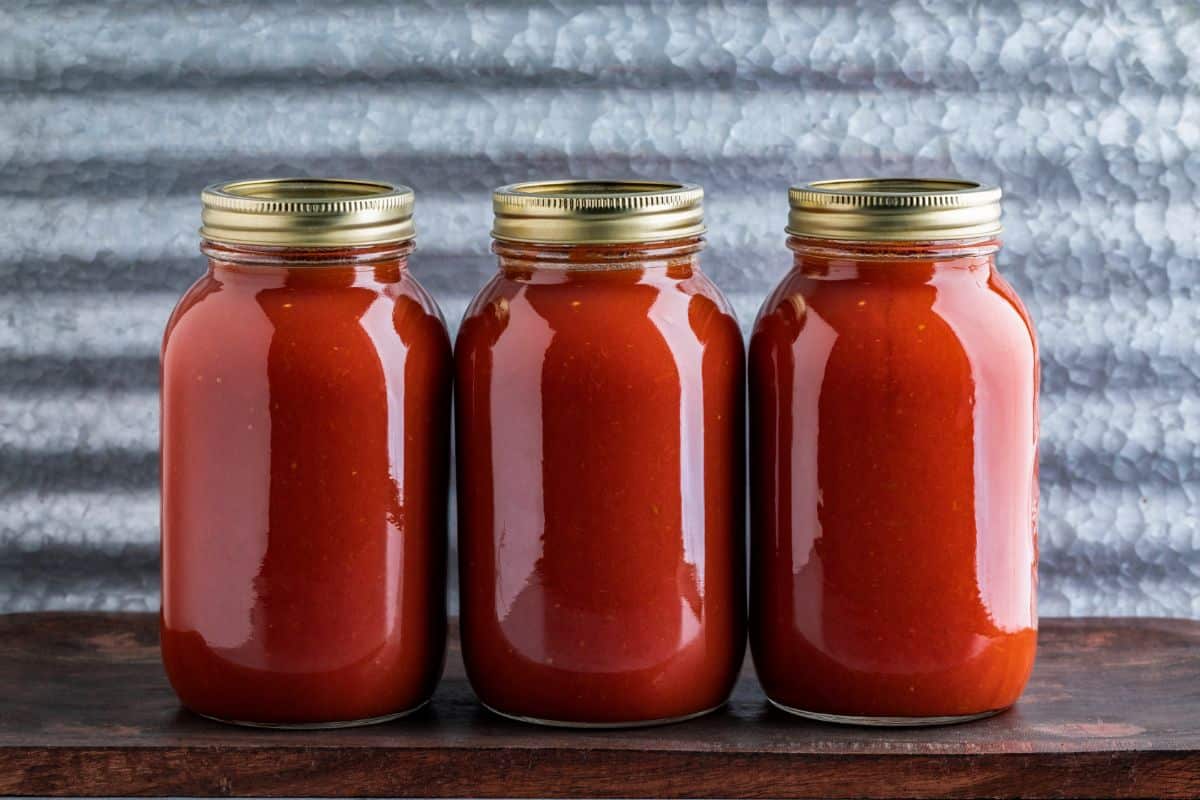 Red tomato sauce canned for shelf storage