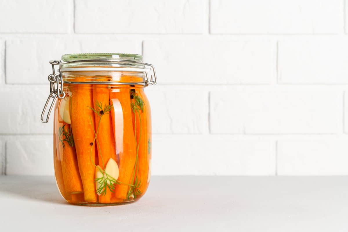 A jar of pickled carrot spears