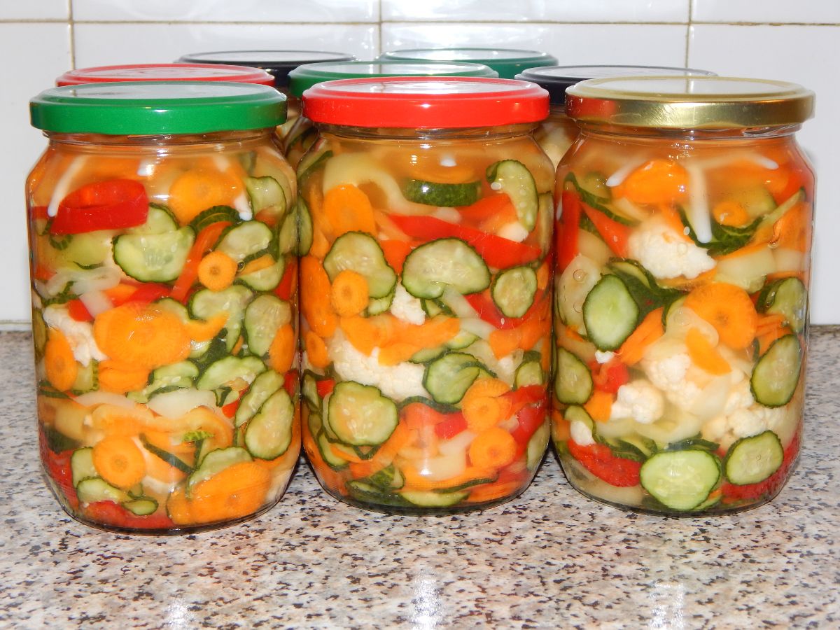 Jars of bright Giardiniera in vinegar