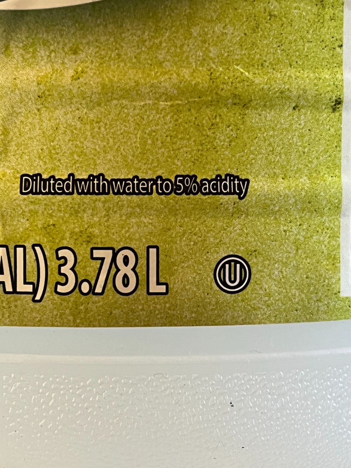 A vinegar bottle marked as 5% acidity