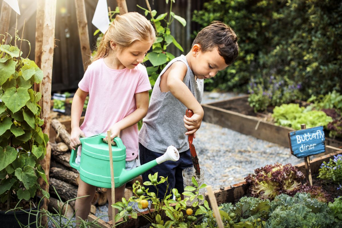 Young children help in the garden