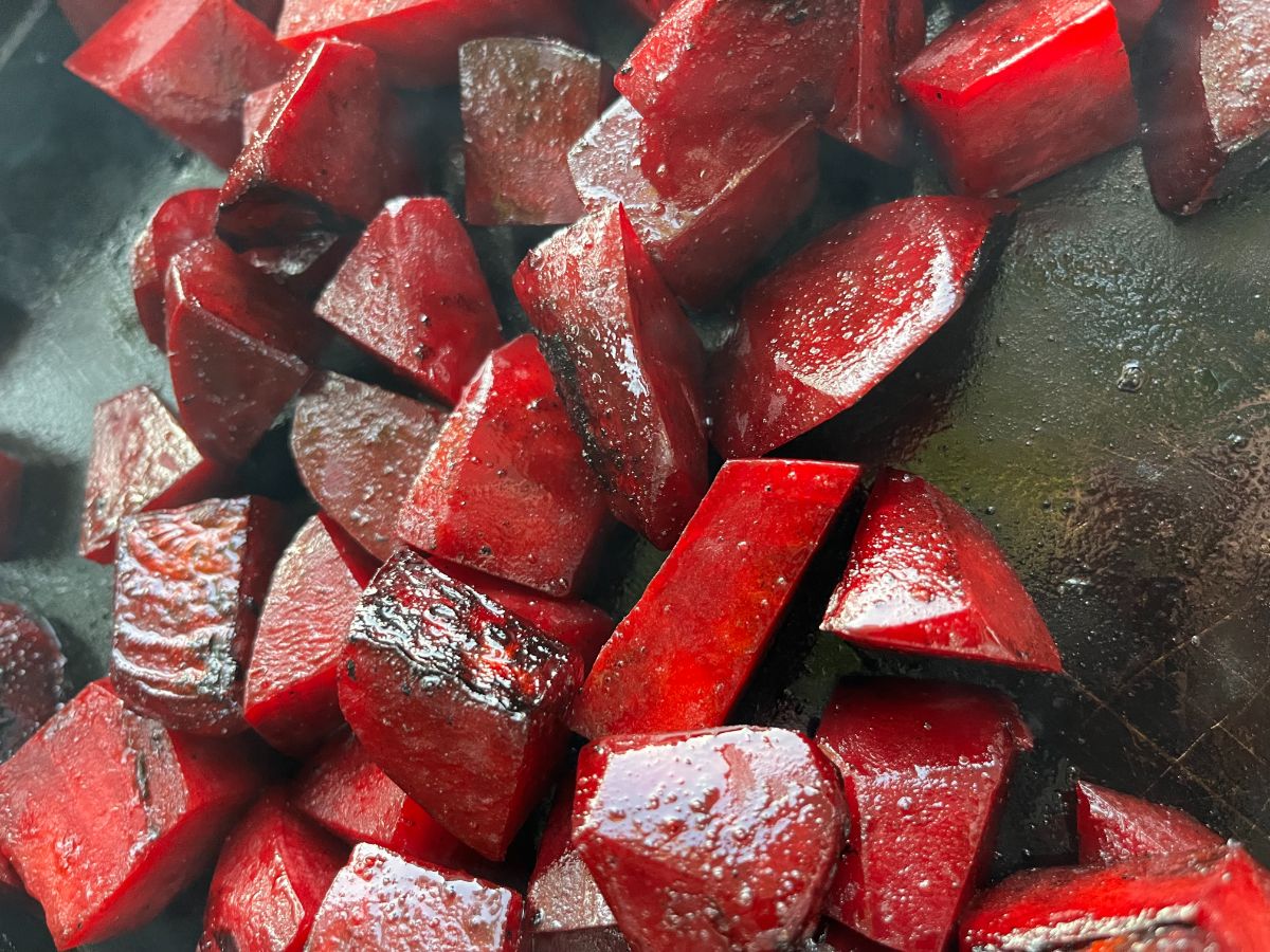 Beets roasting on a flat top grill