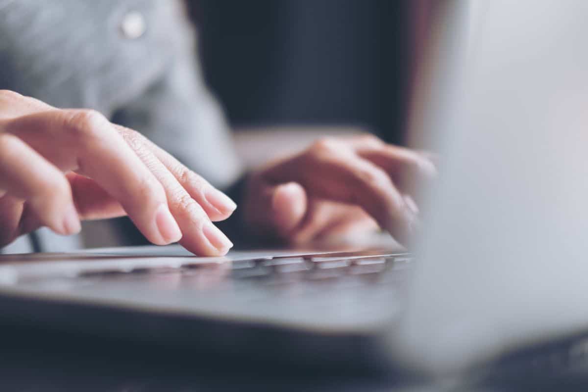 A person typing on a computer