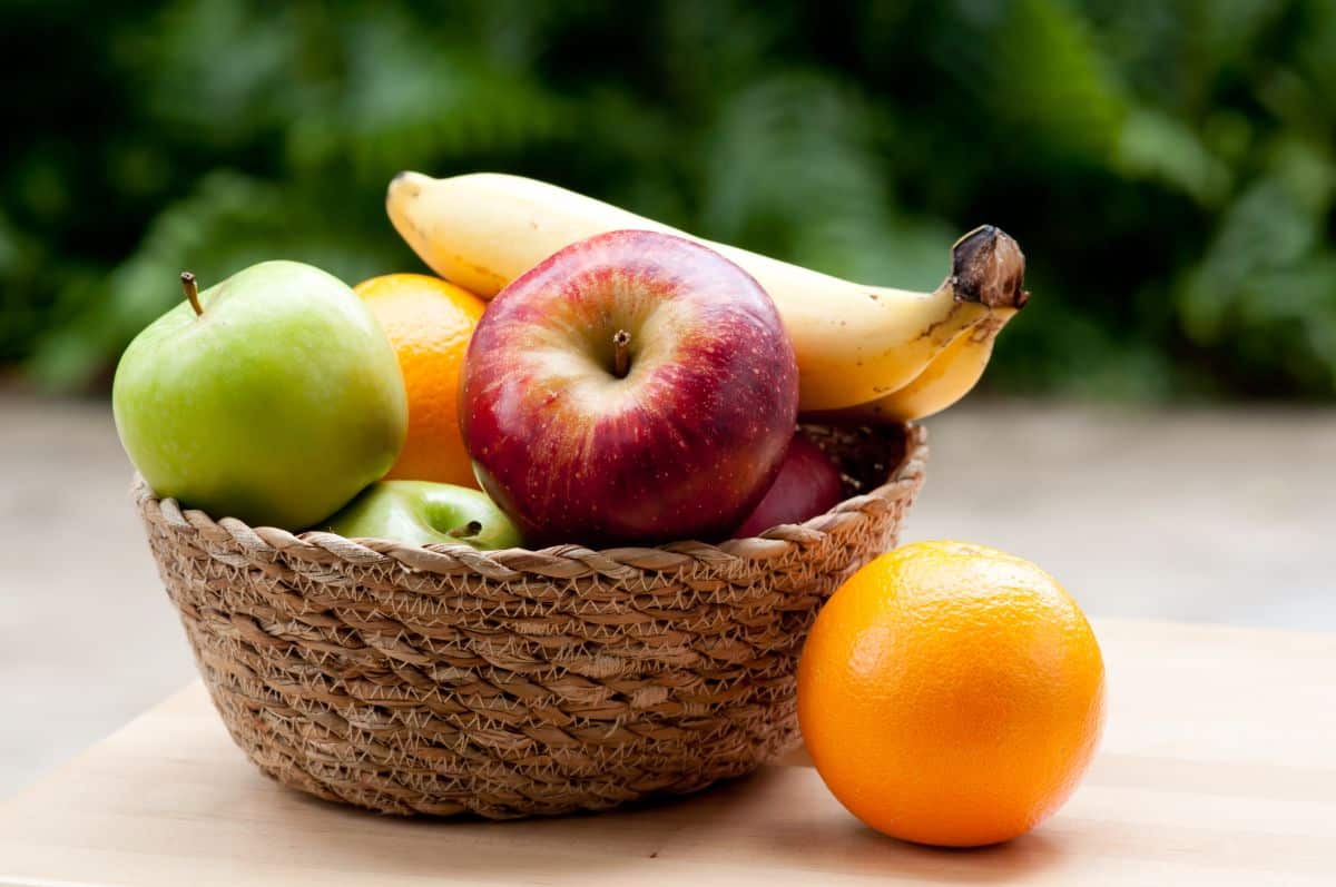 A basket of apples, oranges, and bananas