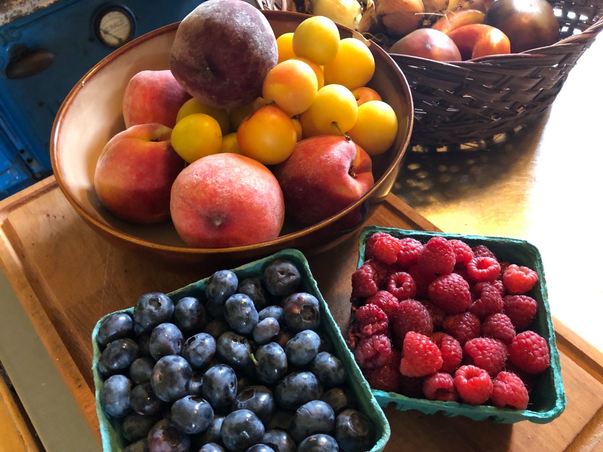 Fresh fruit and berries on a counter
