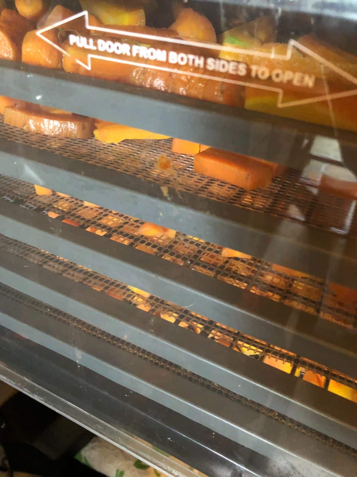 Carrots drying in a dehydrator