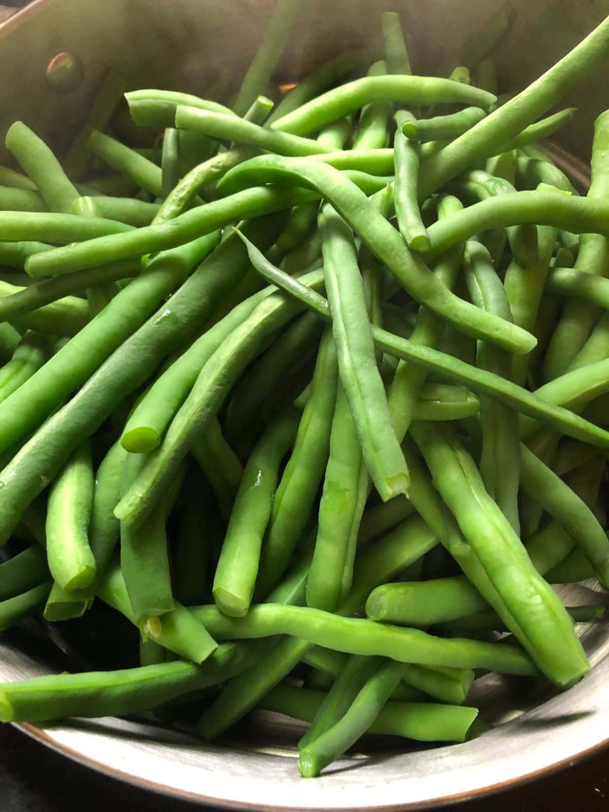 Green beans being prepped for freezing
