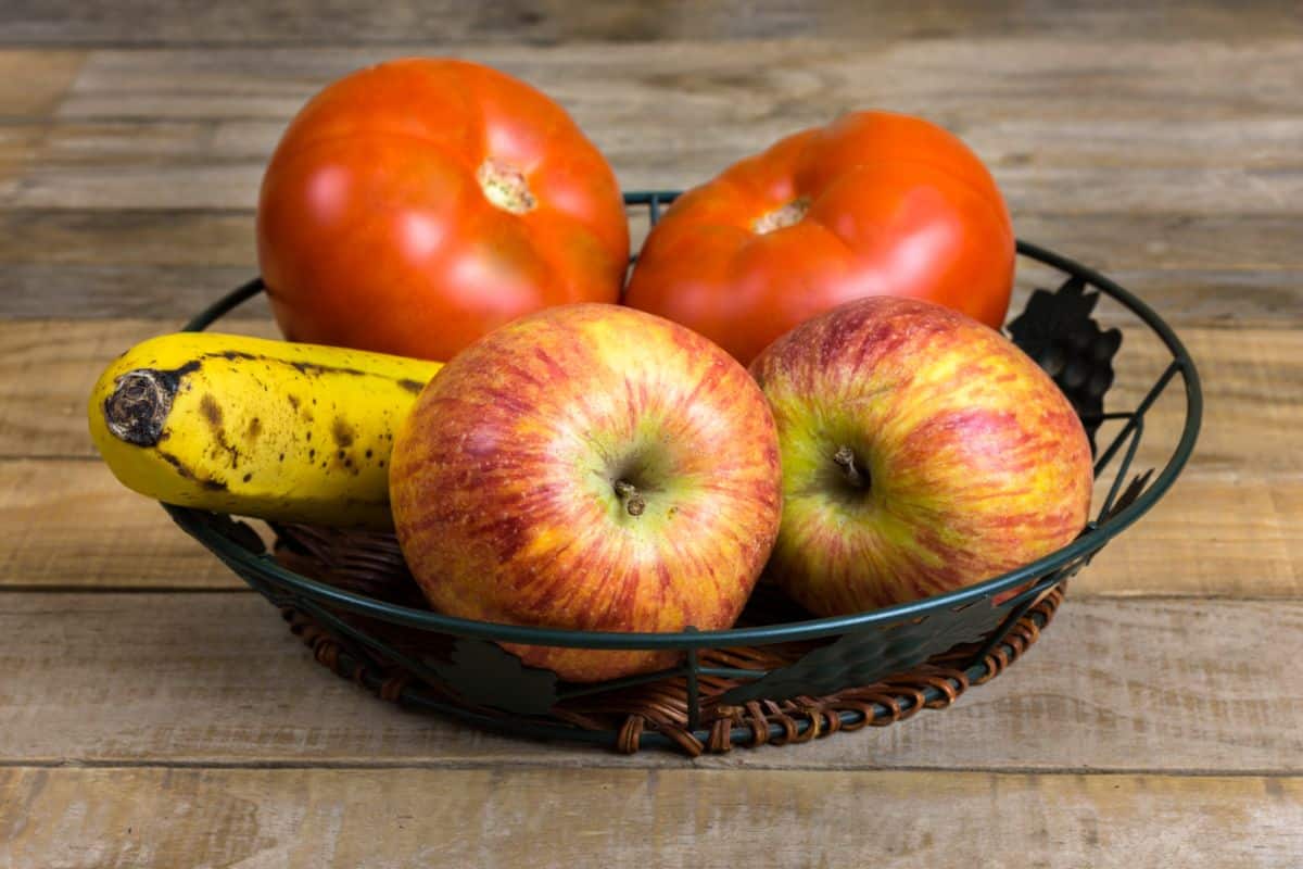 A bowl of fruit on a counter