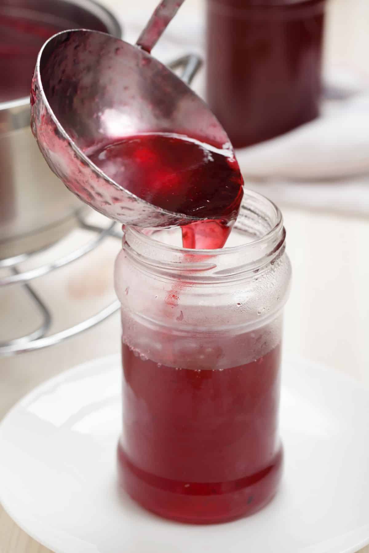 Ladling jelly into a jar