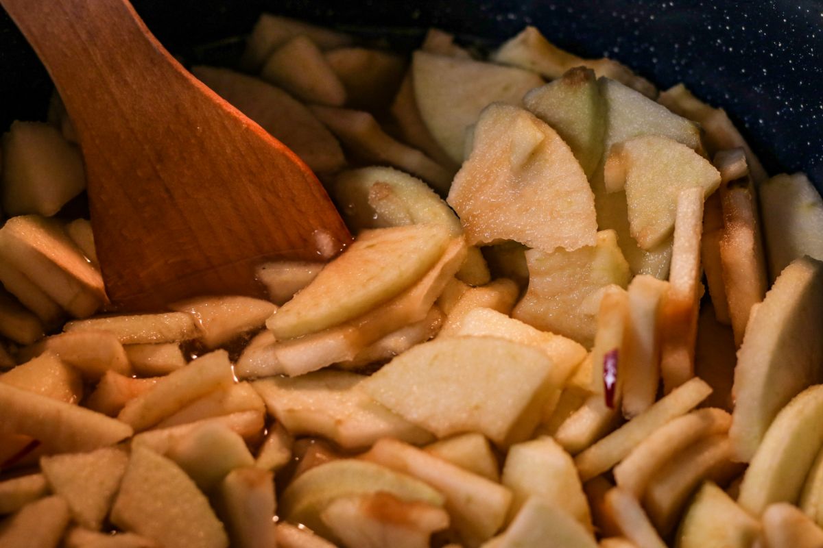 Apple slices cooking in a slow cooker