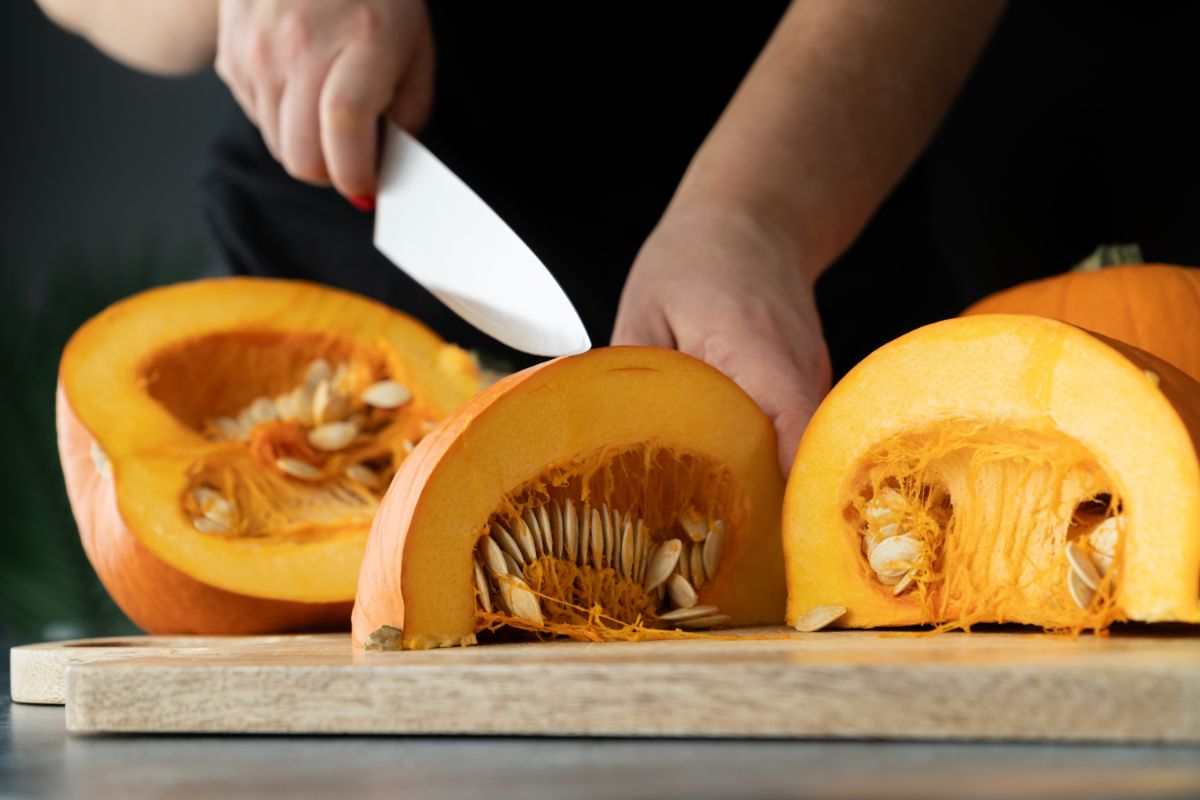 Cutting pumpkin into pieces