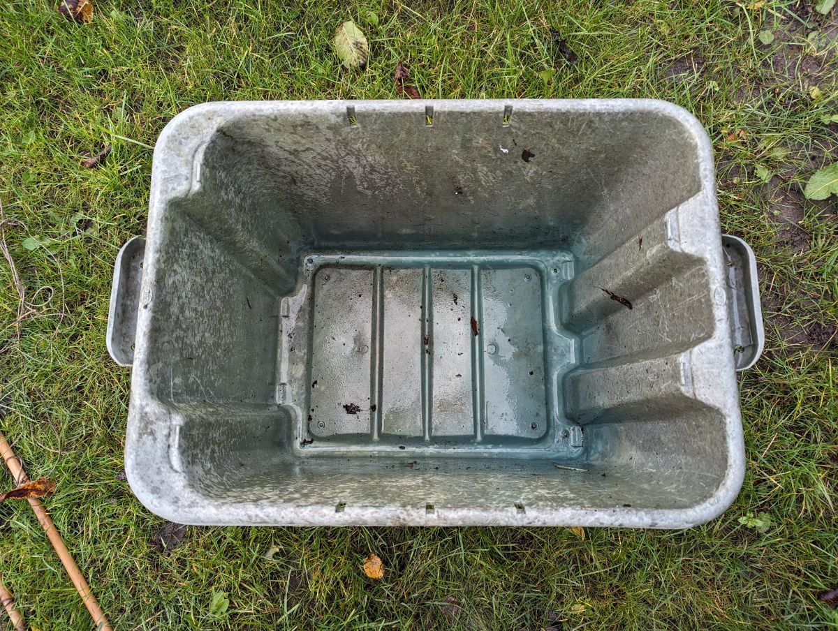 A plastic tub for storing dahlia tubers