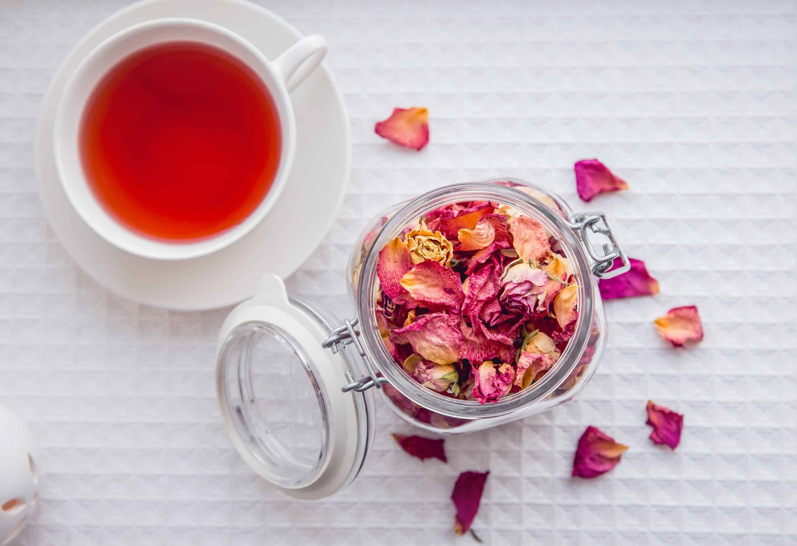 Dried pink rose petals in a jar