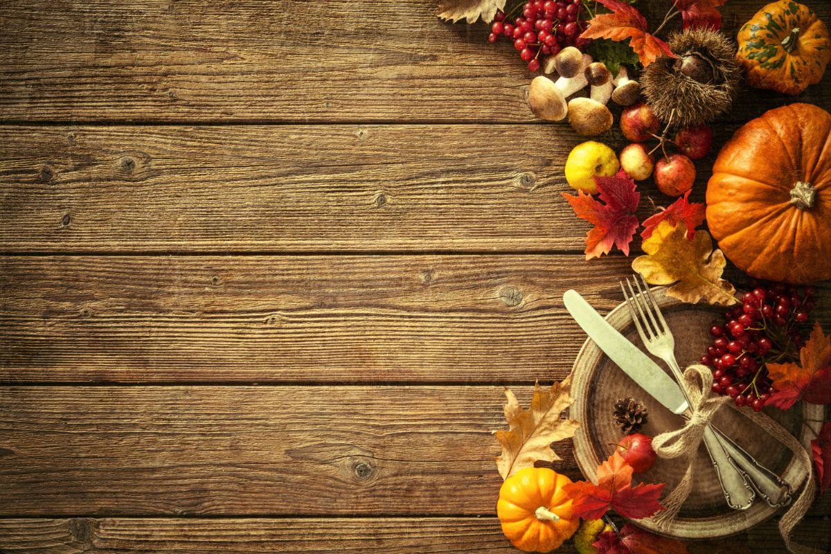 A fall table setting incorporating red berries