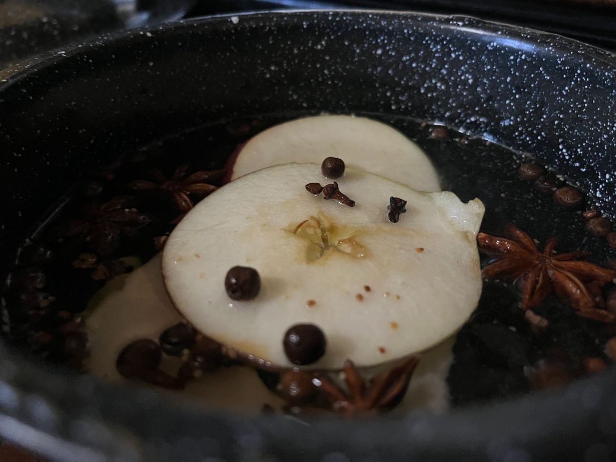 Apple slices and spices in a simmer pot