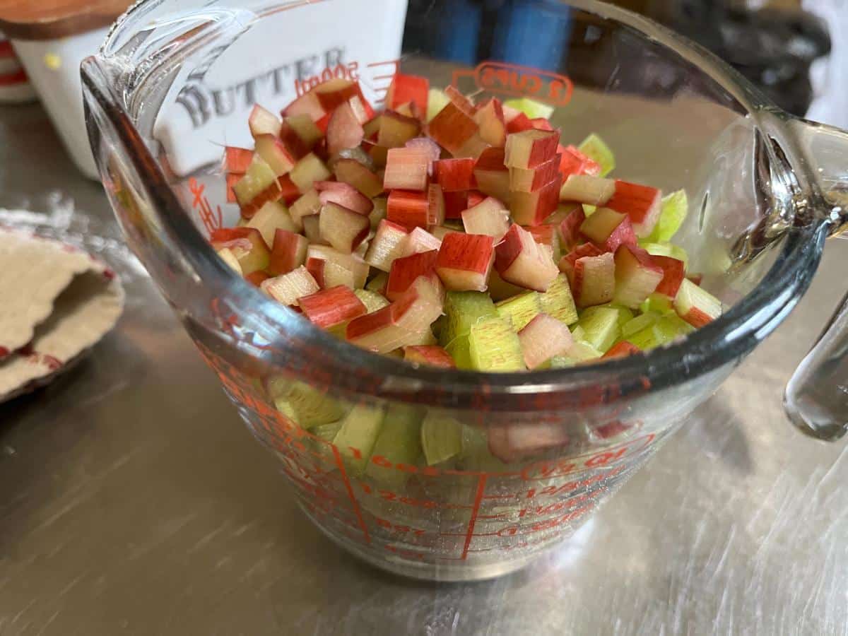Chopped rhubarb in a measuring cup