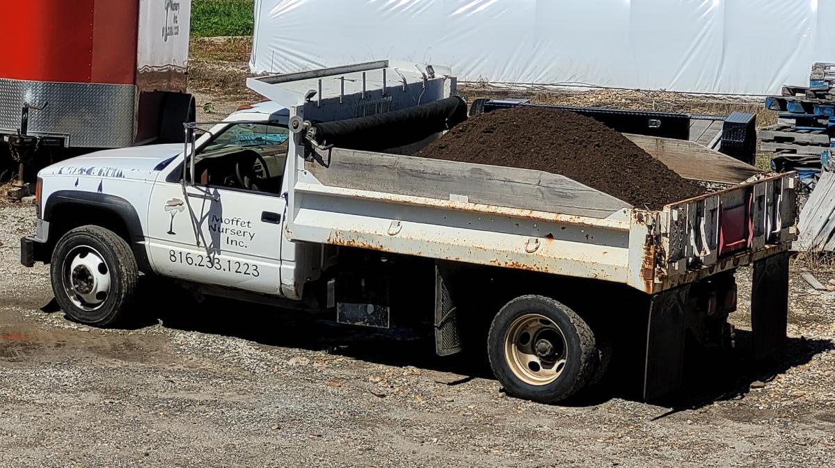 A truck loaded with screened compost